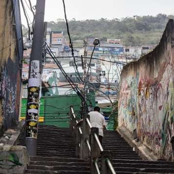 Man going up stairs to favela in Rio de Janeiro, Brazil (2)