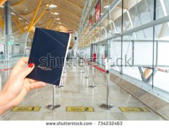 stock-photo-hand-holding-a-generic-passport-just-before-boarding-three-different-lines-group-group-and-734232463